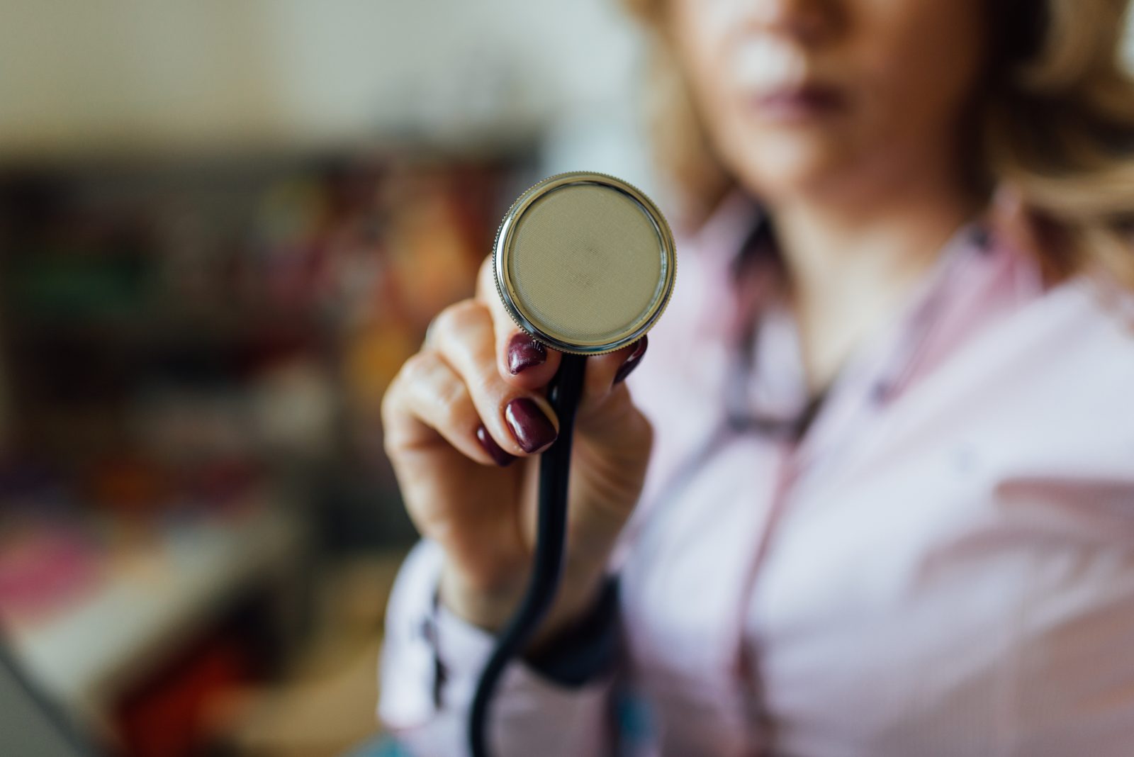 A stethoscope held in a hand